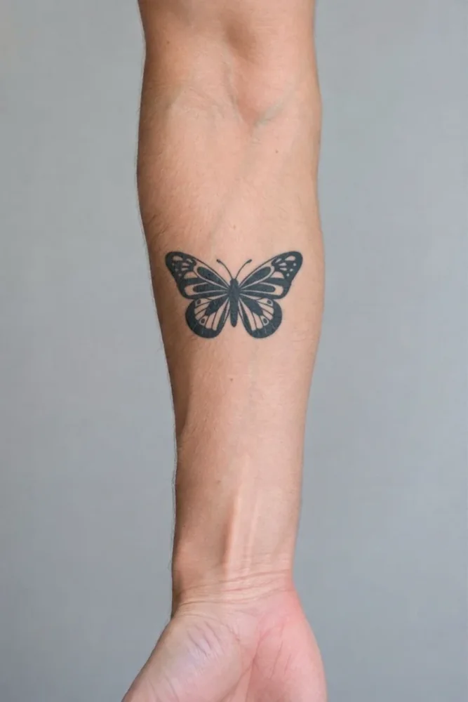 The butterfly blended into the skin of the forearm